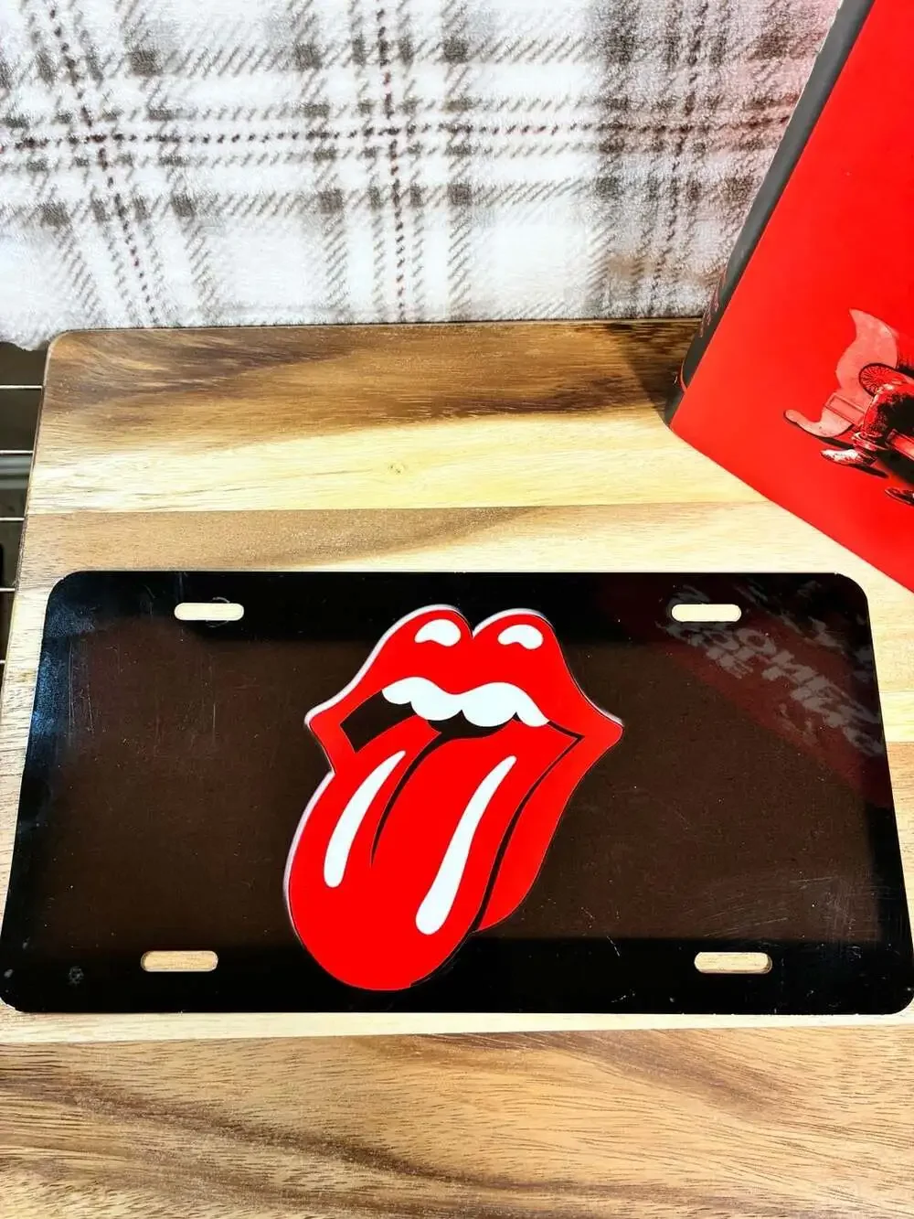 According To The Rolling Stones Hardcover Book And Metal License Plate